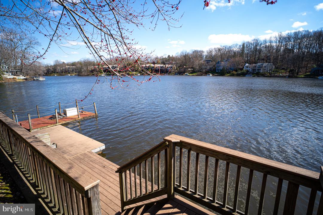 2113 Cabots Point Lane Reston, VA 20191 - Photo 40 of 56 a view of a balcony with wooden floor and lake view
