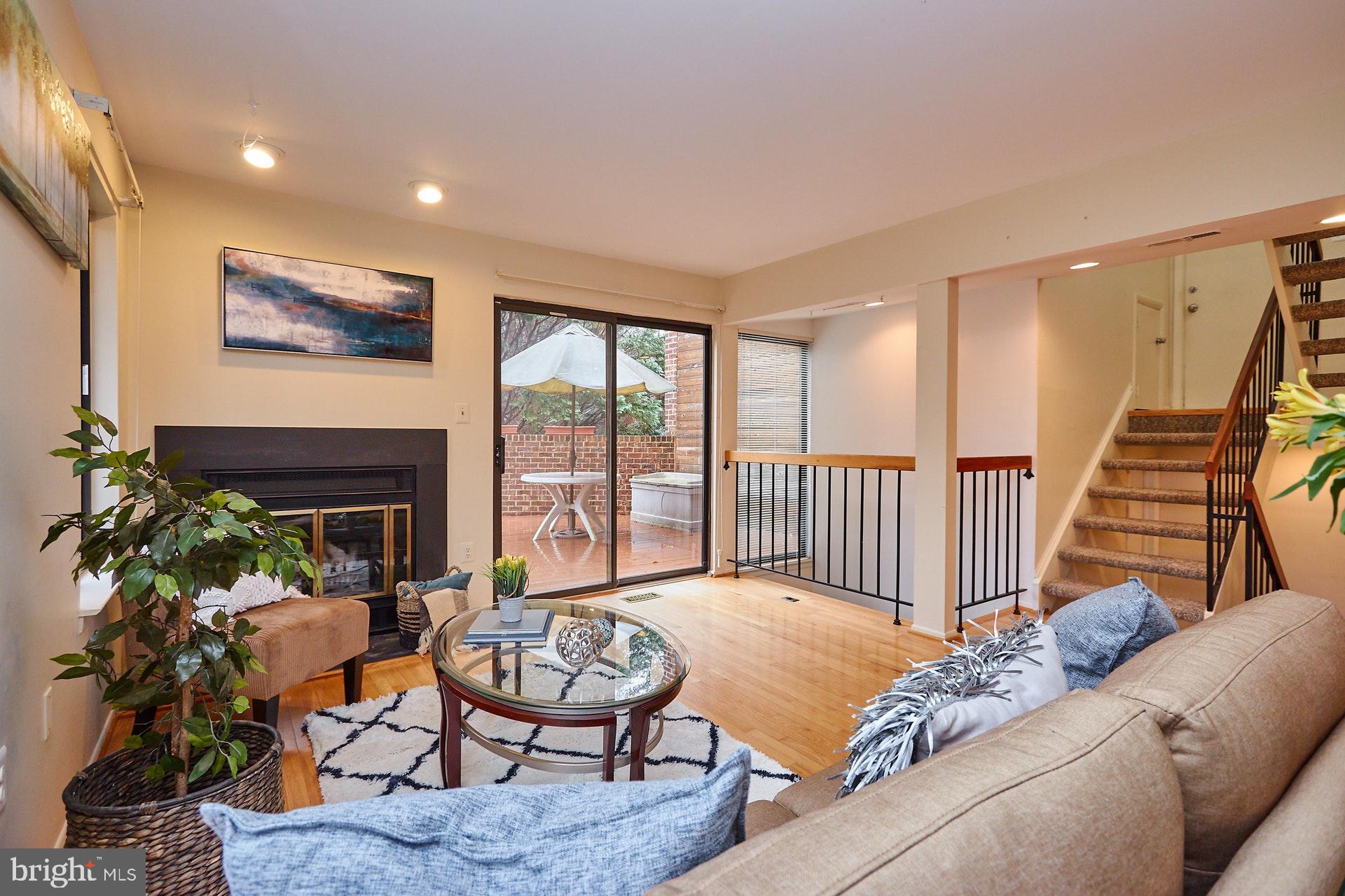 2113 Cabots Point Lane Reston, VA 20191 - Photo 5 of 56 a living room with furniture and a fireplace