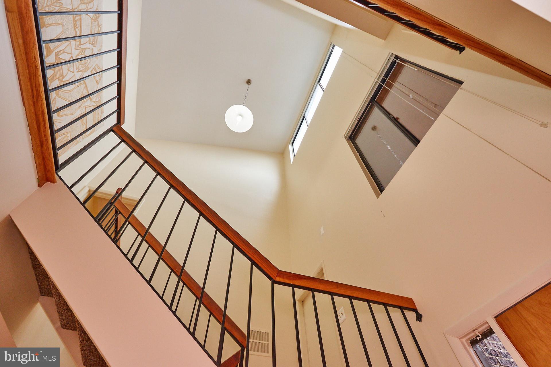 2113 Cabots Point Lane Reston, VA 20191 - Photo 50 of 56 a view of staircase with railing and white walls