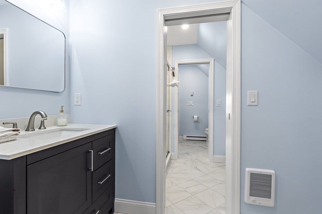 55 Main Street Somerville, MA 02145 - Photo 23 of 28 a bathroom with a sink and a mirror