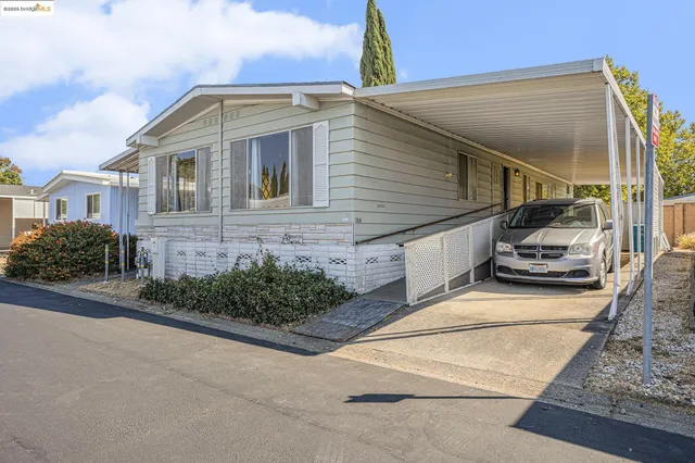 a front view of a house with yard