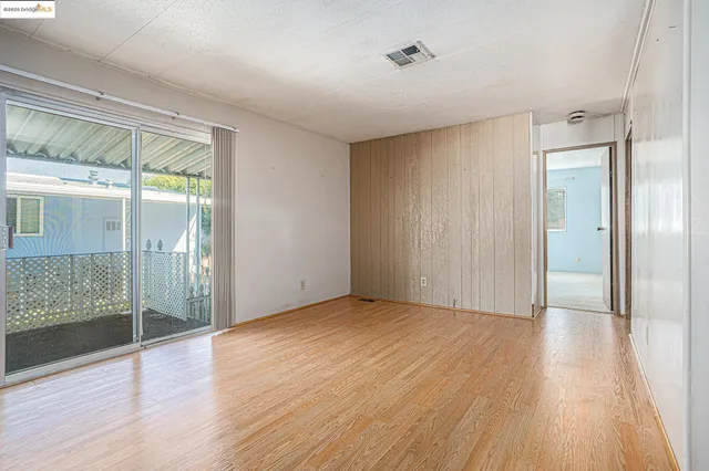 a view of a livingroom with wooden floor