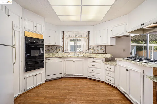 a bathroom with a sink a mirror and a shower