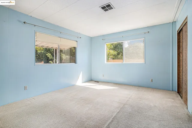 a kitchen with stainless steel appliances a refrigerator sink and cabinets