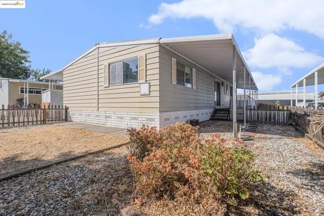 a backyard of a house with garage