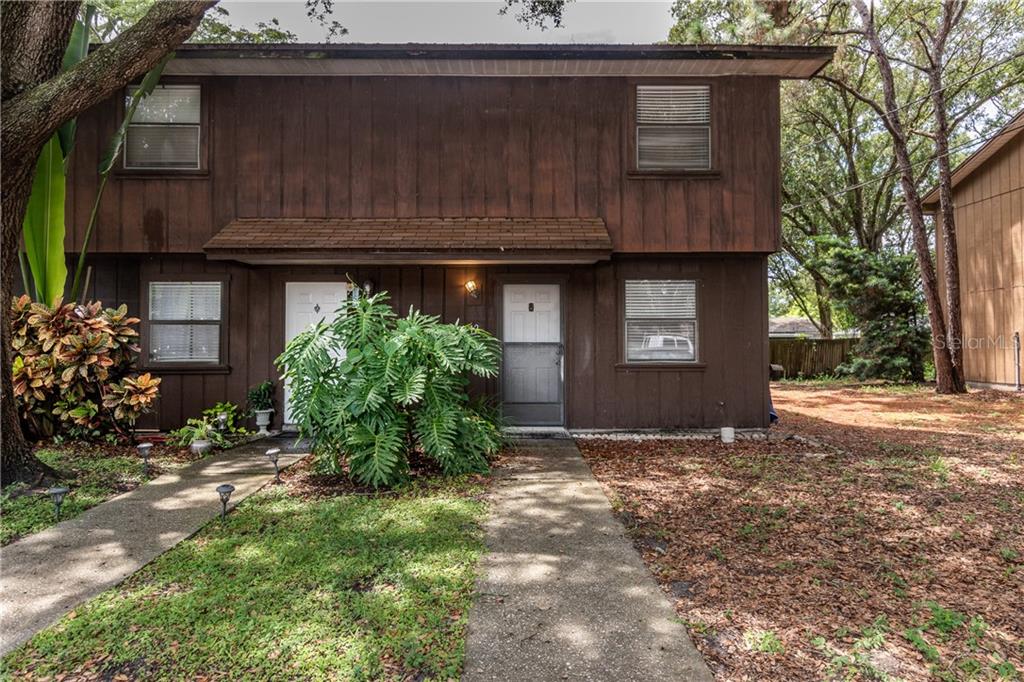 1890 Wolford Road, Unit 12 Clearwater, FL 33760 - Photo 1 of 1 a view of a house with a small yard