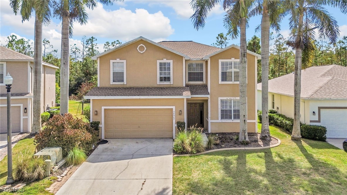14067 Danpark Loop Fort Myers, FL 33912 - Photo 1 of 41 a front view of a house with a garden and patio