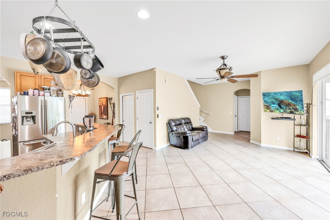 14067 Danpark Loop Fort Myers, FL 33912 - Photo 12 of 41 a view of living room with furniture and chandelier