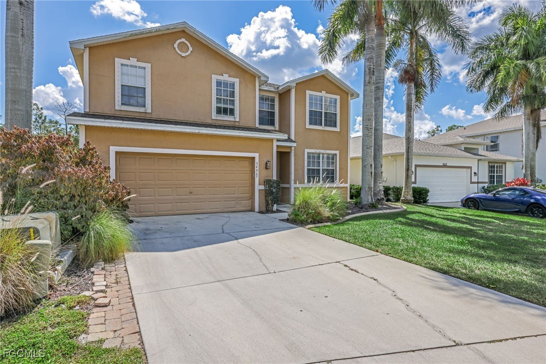 14067 Danpark Loop Fort Myers, FL 33912 - Photo 4 of 41 a front view of a house with garden