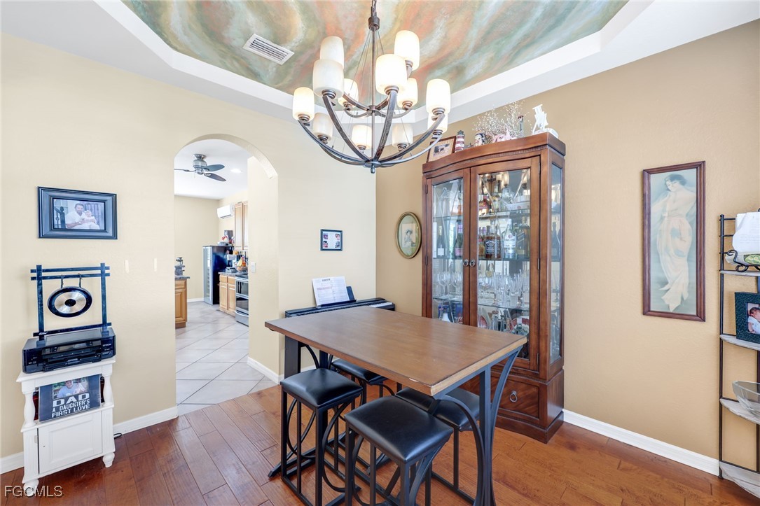 14067 Danpark Loop Fort Myers, FL 33912 - Photo 6 of 41 a view of a dining room with furniture window and wooden floor