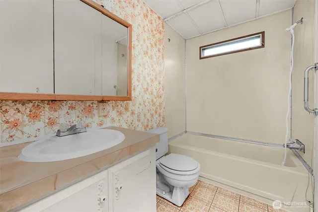 a bathroom with a sink a toilet and a bathtub