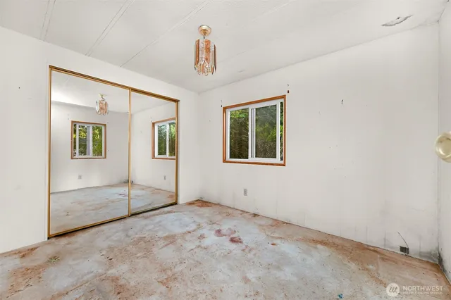 a view of empty room with windows