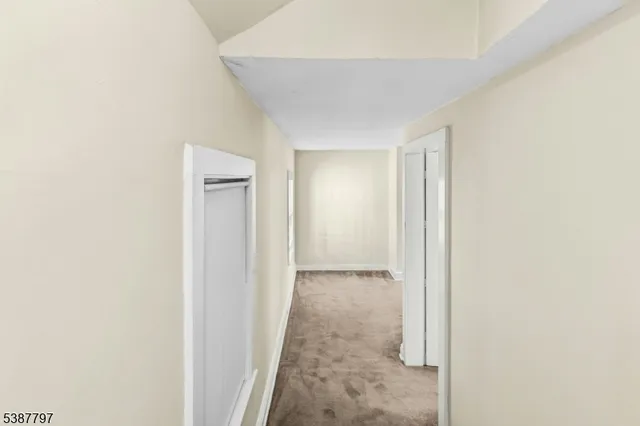 a view of a room that has a window in it