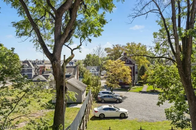 a view of a wooden fence and trees