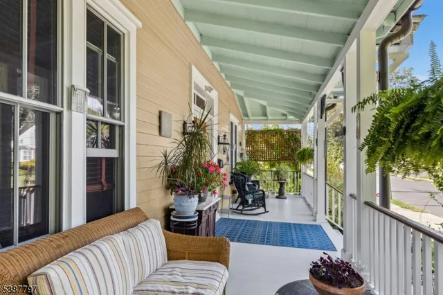 a living room with furniture and flowers