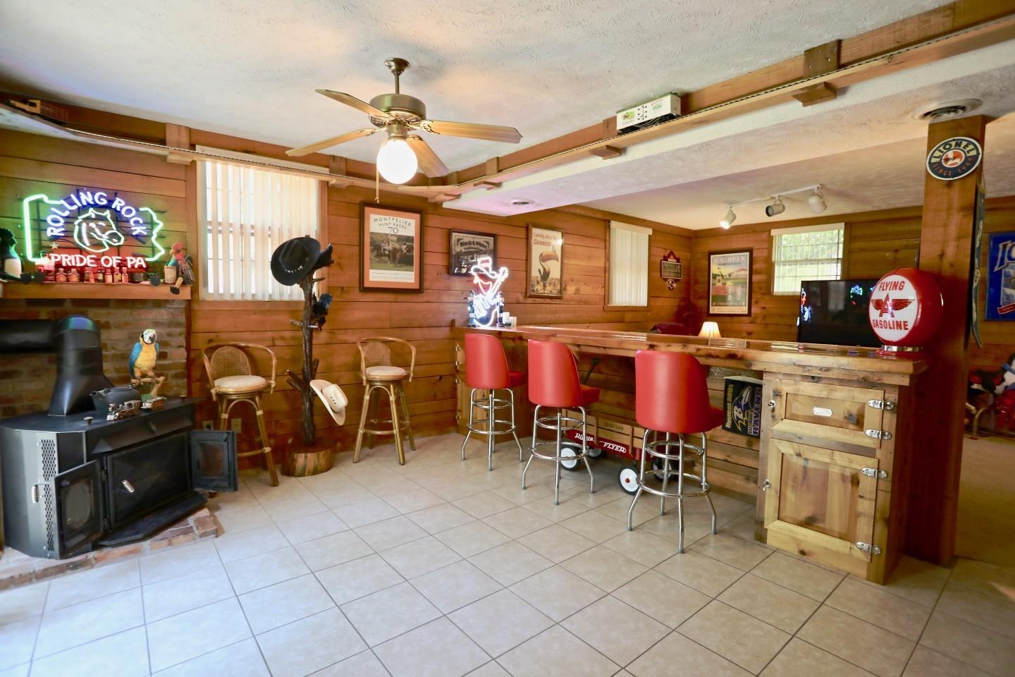 170 Boiling Spring Circle Southern Pines, NC 28387 - Photo 25 of 46 Lower level family room with bar