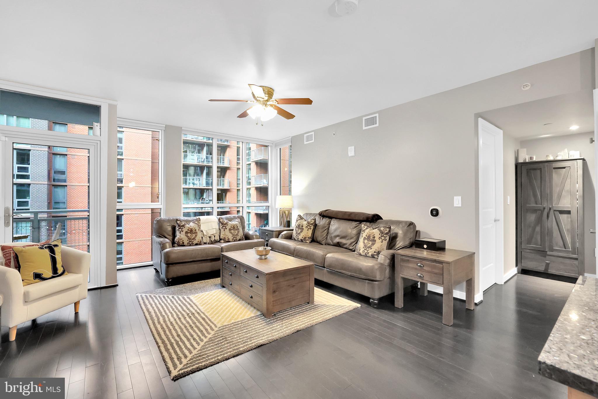 1025 First Street Southeast, Unit 602 Washington, DC 20003 - Photo 12 of 49 a living room with furniture or couch and a wooden floor