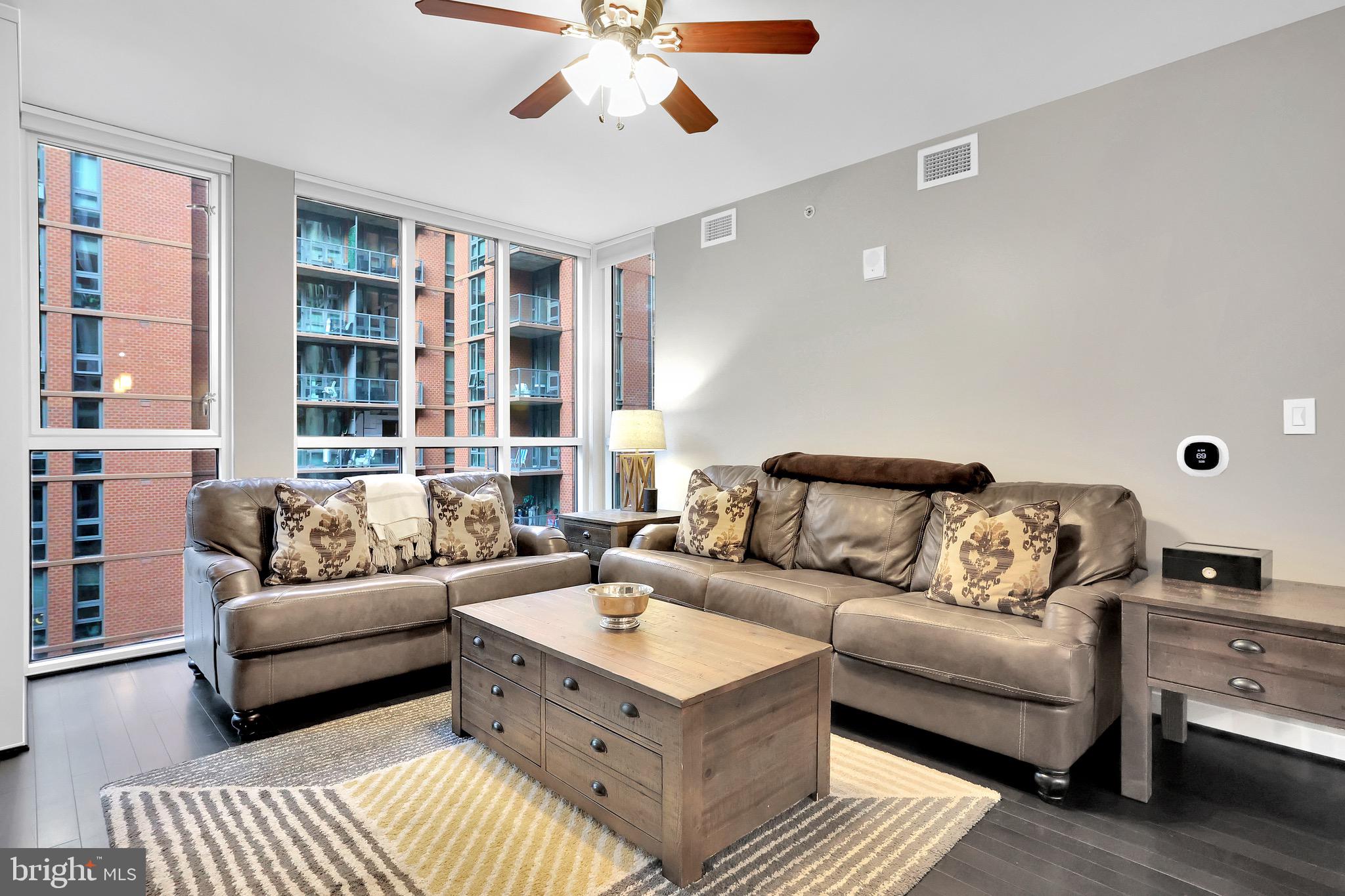 1025 First Street Southeast, Unit 602 Washington, DC 20003 - Photo 13 of 49 a living room with furniture and a rug