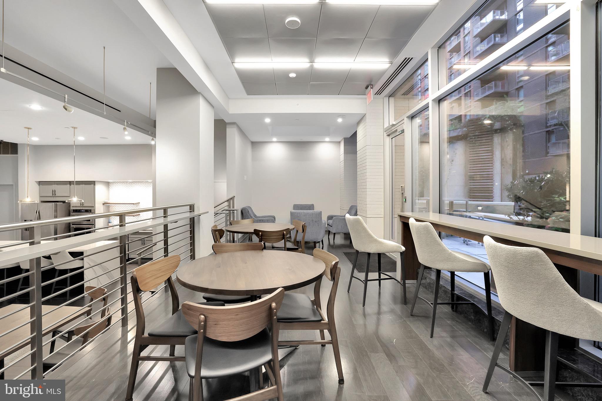 1025 First Street Southeast, Unit 602 Washington, DC 20003 - Photo 37 of 49 a dining room with stainless steel appliances kitchen island granite countertop a dining table chairs and view living room