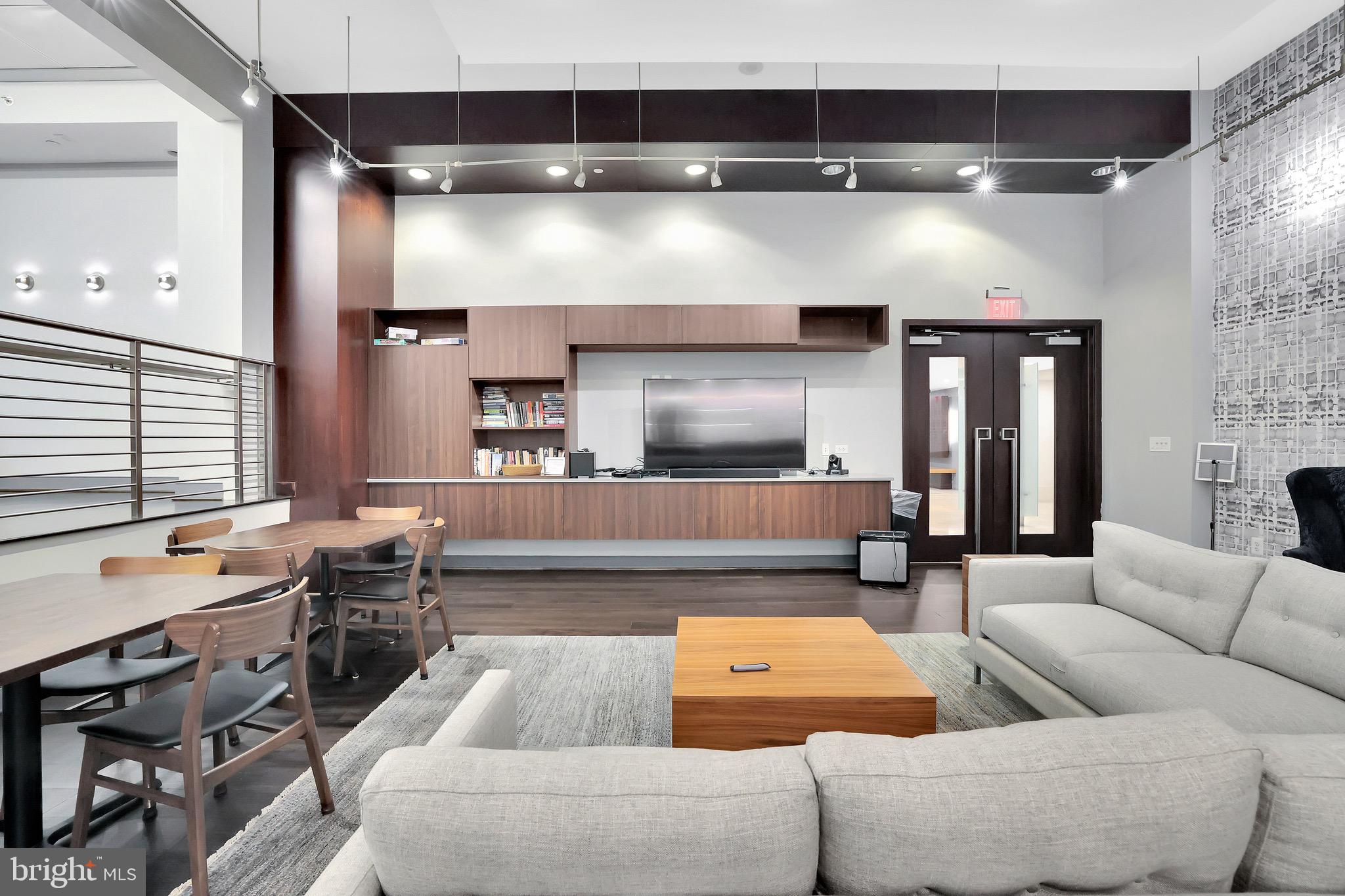 1025 First Street Southeast, Unit 602 Washington, DC 20003 - Photo 38 of 49 a living room with furniture and a flat screen tv