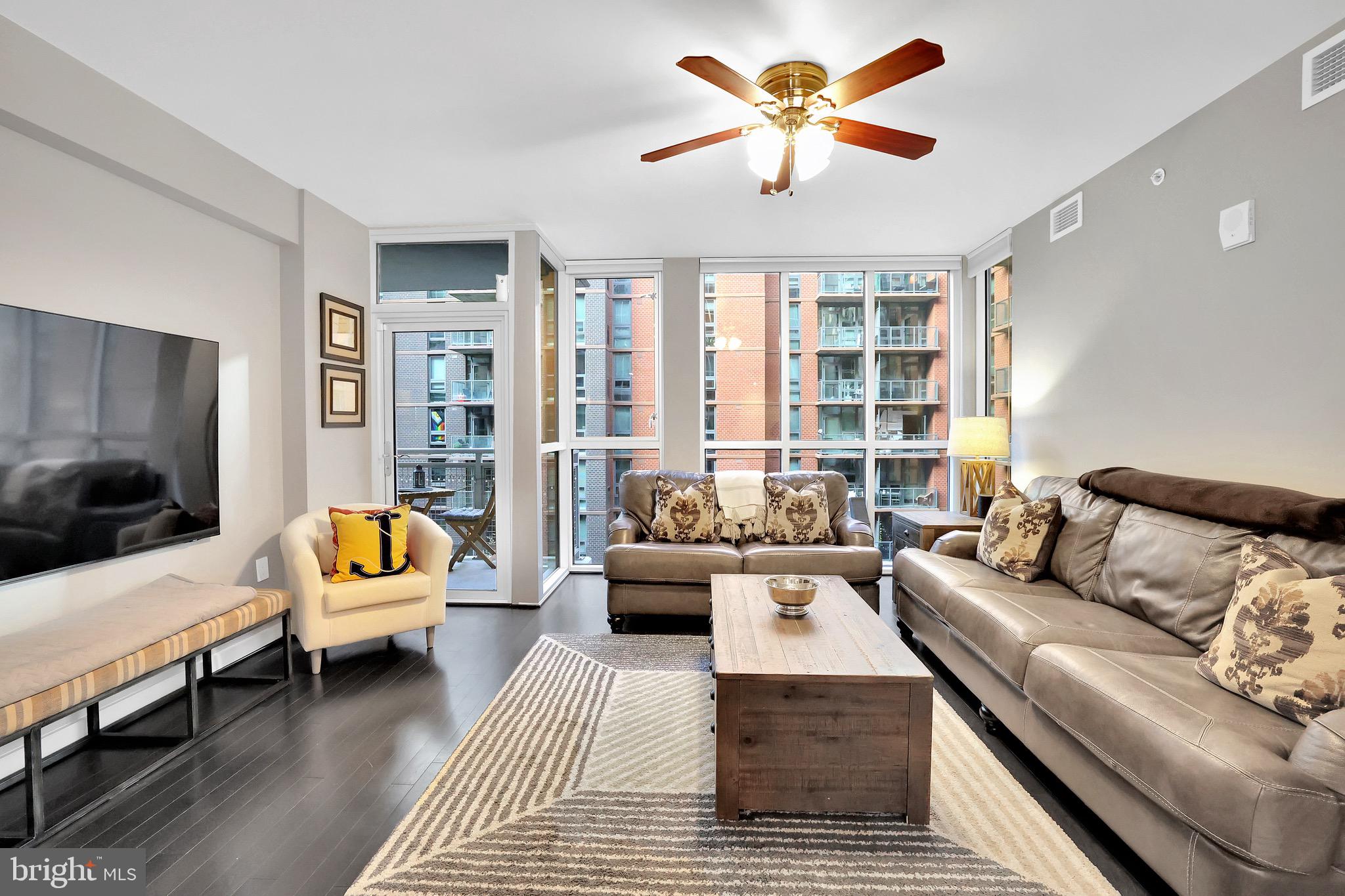 1025 First Street Southeast, Unit 602 Washington, DC 20003 - Photo 10 of 49 a living room with furniture and a large window