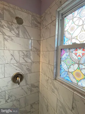 a bathroom with a sink and a shower