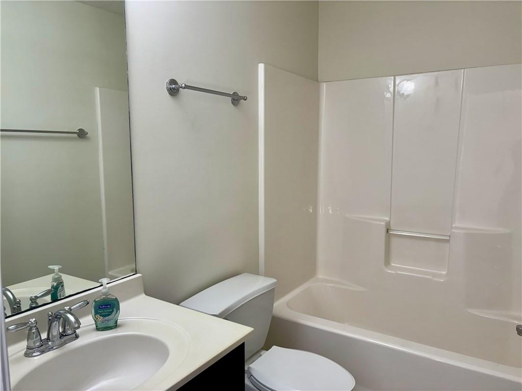 208 Maple Street Dawsonville, GA 30534 - Photo 13 of 21 a bathroom with a sink toilet and a bathtub