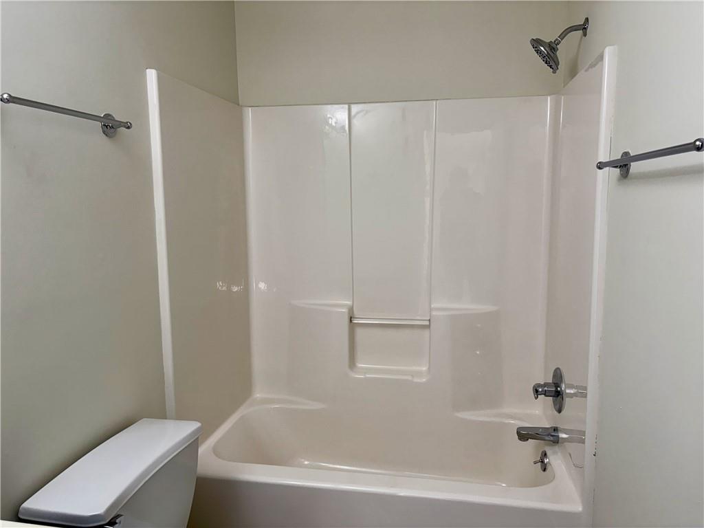 208 Maple Street Dawsonville, GA 30534 - Photo 14 of 21 a white bath tub with a shower