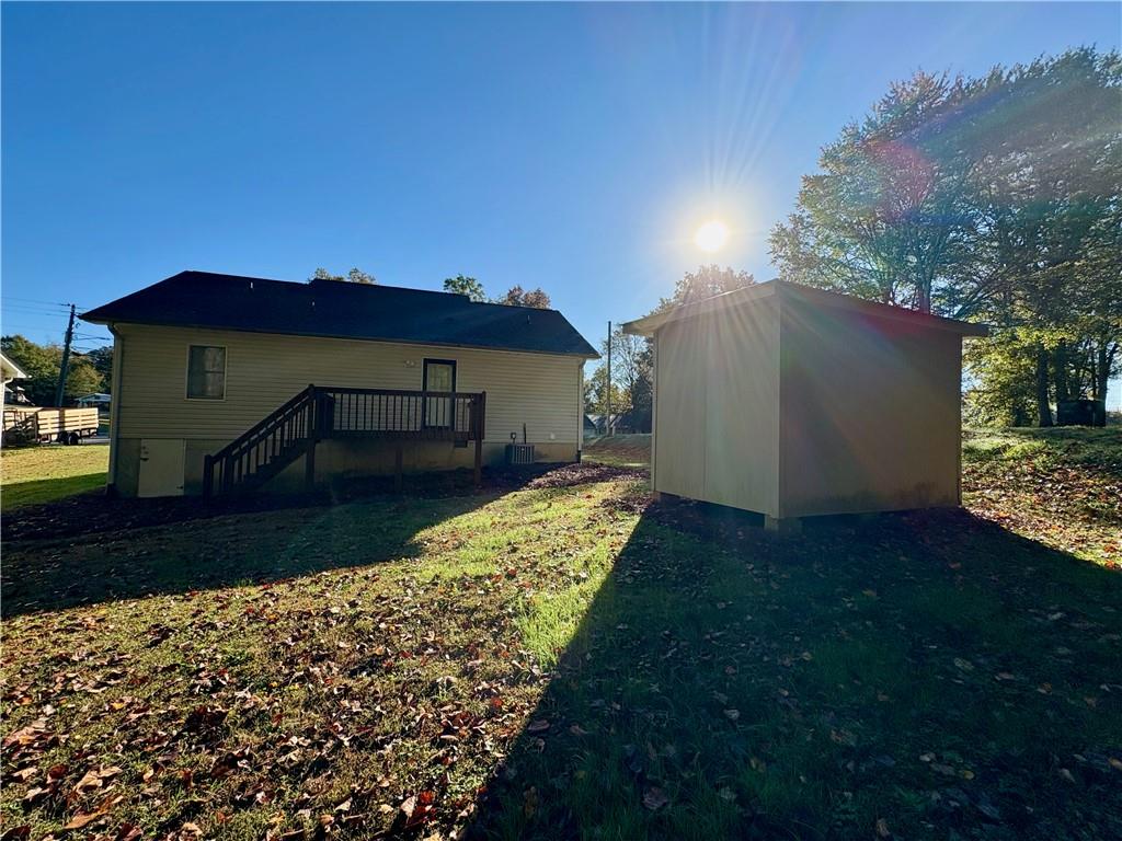 208 Maple Street Dawsonville, GA 30534 - Photo 19 of 21 a view of a house with a yard