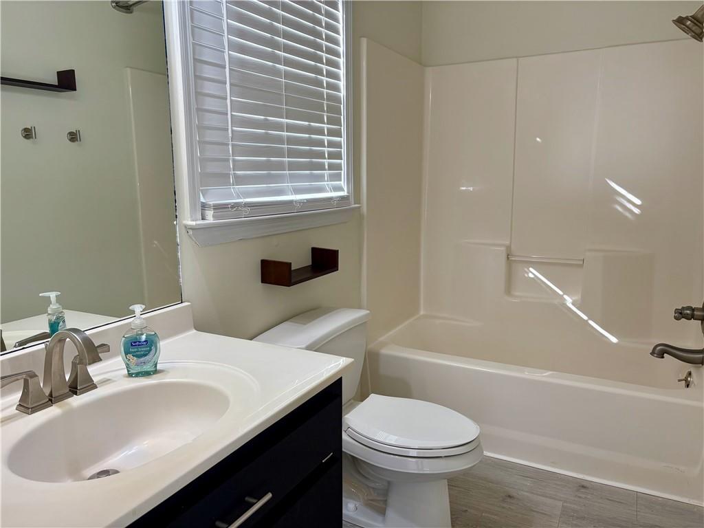208 Maple Street Dawsonville, GA 30534 - Photo 10 of 21 a bathroom with a sink toilet and shower