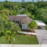 a aerial view of house with yard
