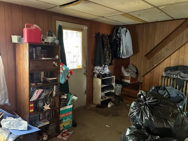 a bedroom with a bed and a closet