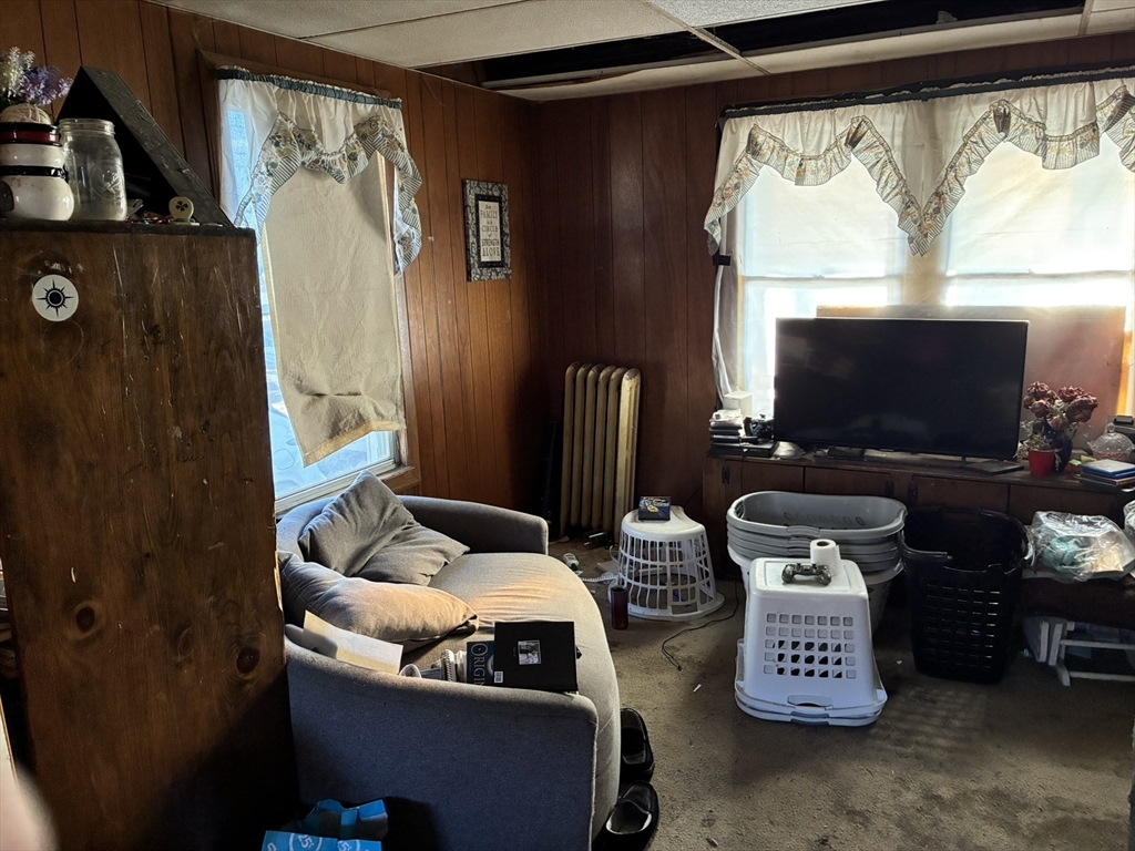188 Windsor Street West Springfield, MA 01089 - Photo 5 of 13 a living room with furniture and a flat screen tv
