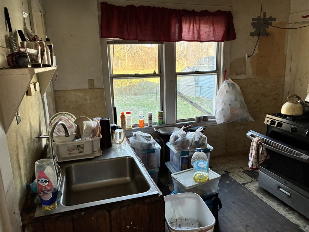 188 Windsor Street West Springfield, MA 01089 - Photo 6 of 13 a room with furniture and a window