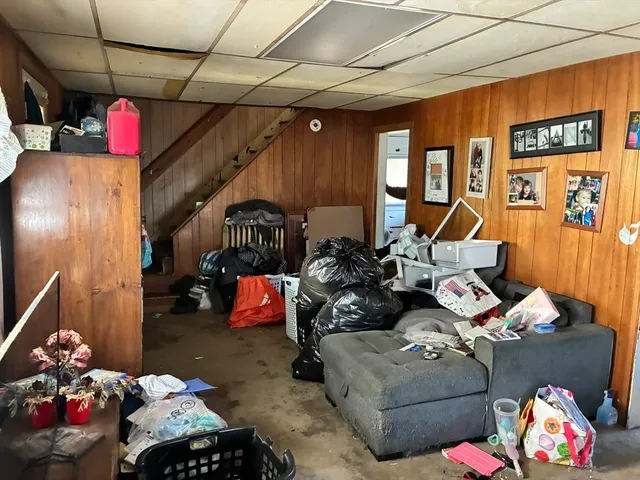 a kitchen with stainless steel appliances a refrigerator and a window