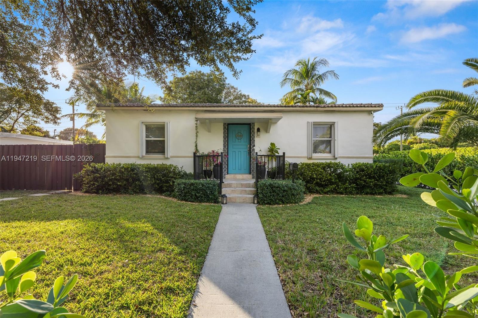 550 Cardinal Street Miami Springs, FL 33166 - Photo 1 of 33 a front view of a house with garden