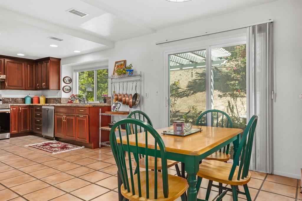 1991 Paseo Del Rey Vista, CA 92084 - Photo 13 of 42 a view of a dining room with furniture window and outside view