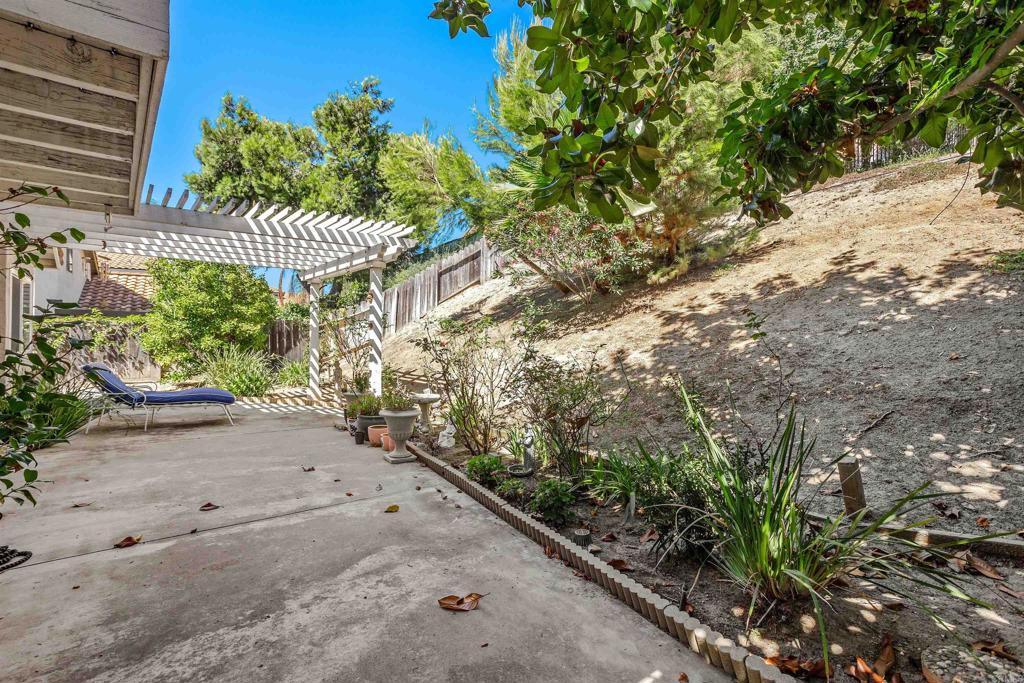1991 Paseo Del Rey Vista, CA 92084 - Photo 21 of 42 a view of a pathway with a flower garden