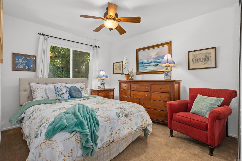 1991 Paseo Del Rey Vista, CA 92084 - Photo 24 of 42 a bedroom with a bed couch and window