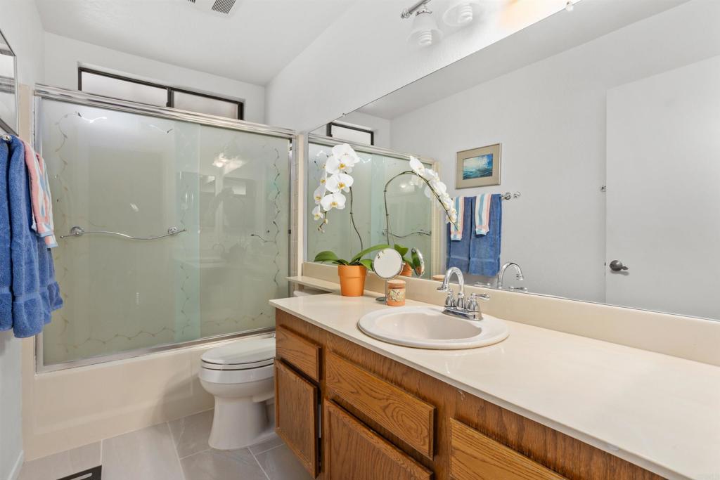 1991 Paseo Del Rey Vista, CA 92084 - Photo 28 of 42 a bathroom with a sink toilet and shower