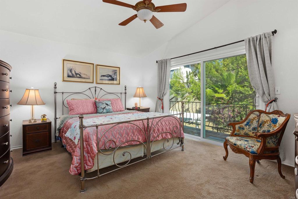 1991 Paseo Del Rey Vista, CA 92084 - Photo 29 of 42 a bedroom with a bed and a couch