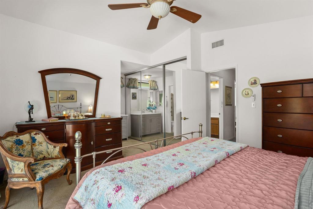 1991 Paseo Del Rey Vista, CA 92084 - Photo 31 of 42 a bedroom with a bed and a dresser in it