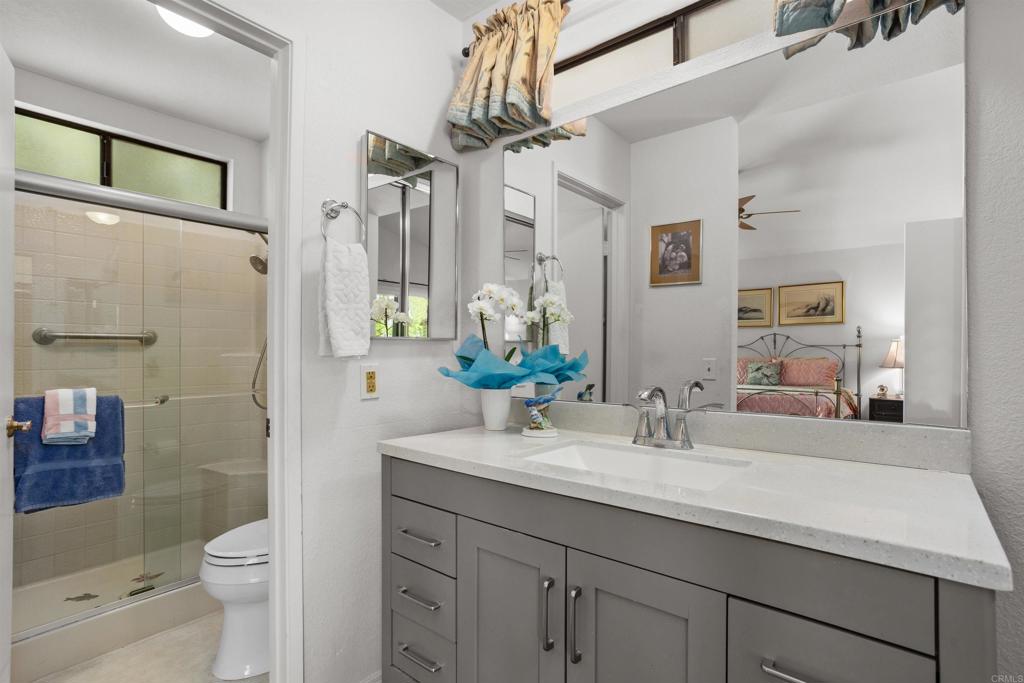 1991 Paseo Del Rey Vista, CA 92084 - Photo 32 of 42 a bathroom with a sink a toilet and shower