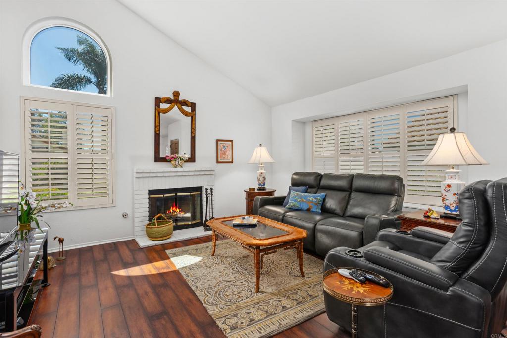 1991 Paseo Del Rey Vista, CA 92084 - Photo 5 of 42 a living room with furniture a fireplace and wooden floor
