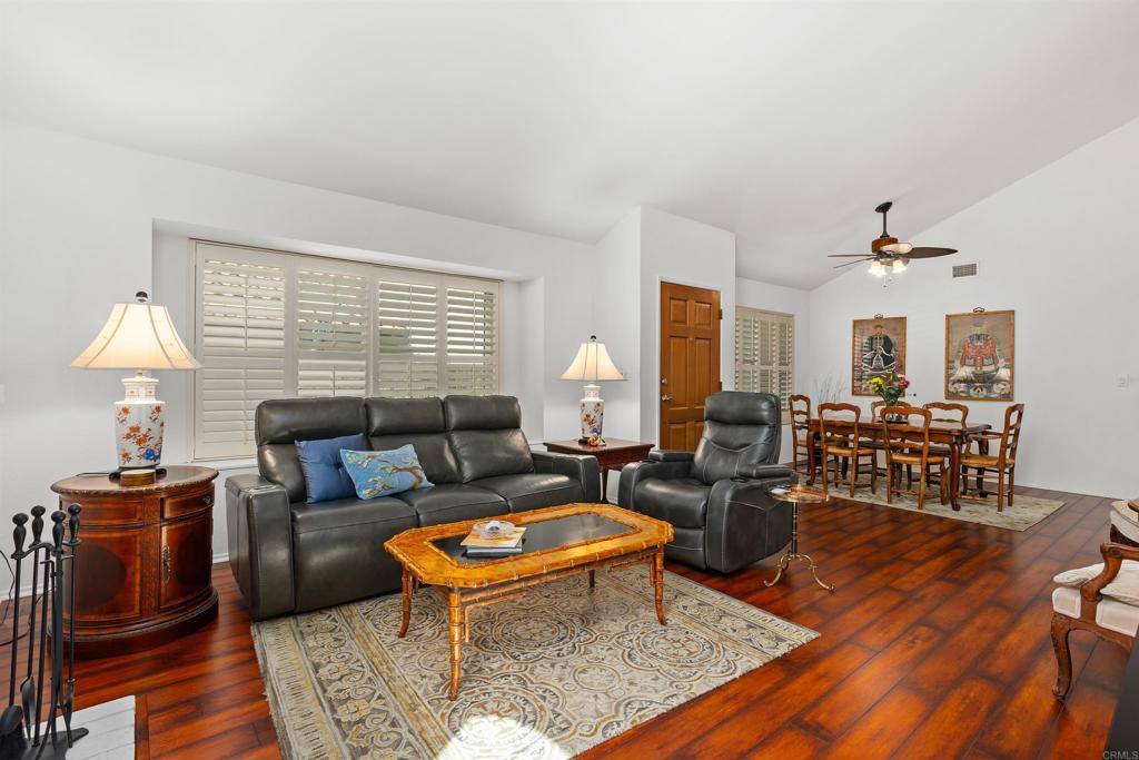 1991 Paseo Del Rey Vista, CA 92084 - Photo 8 of 42 a living room with furniture a lamp and a table