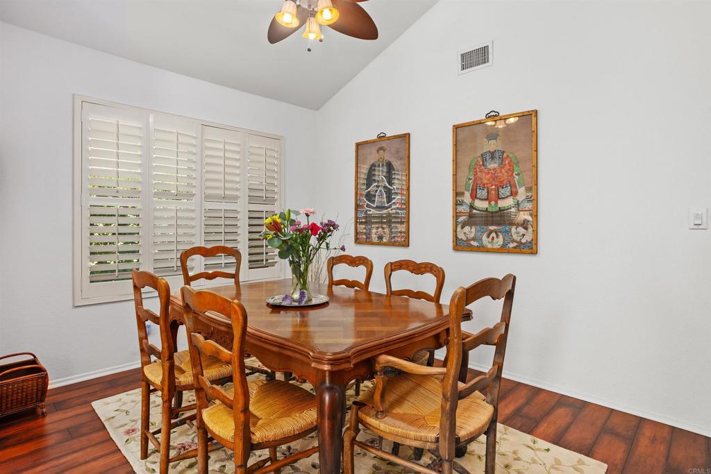 1991 Paseo Del Rey Vista, CA 92084 - Photo 10 of 42 a dining room with furniture and wooden floor
