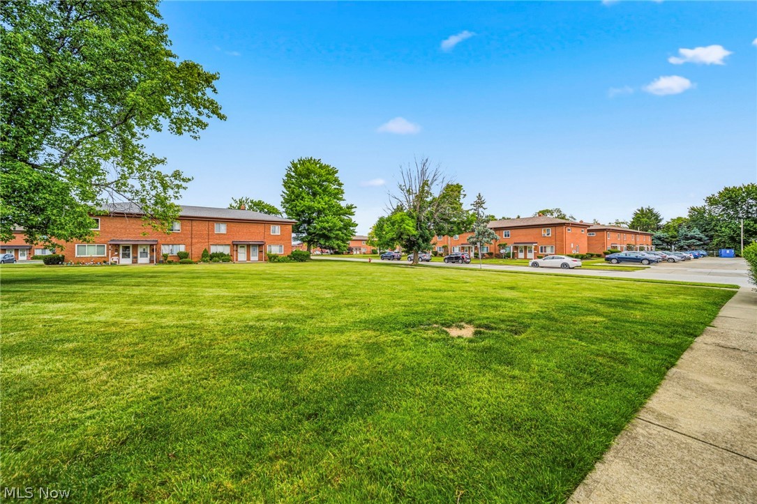 1694 Ridgewick Drive Wickliffe, OH 44092 - Photo 25 of 30 Expansive green lawn with mature trees and a paved walkway