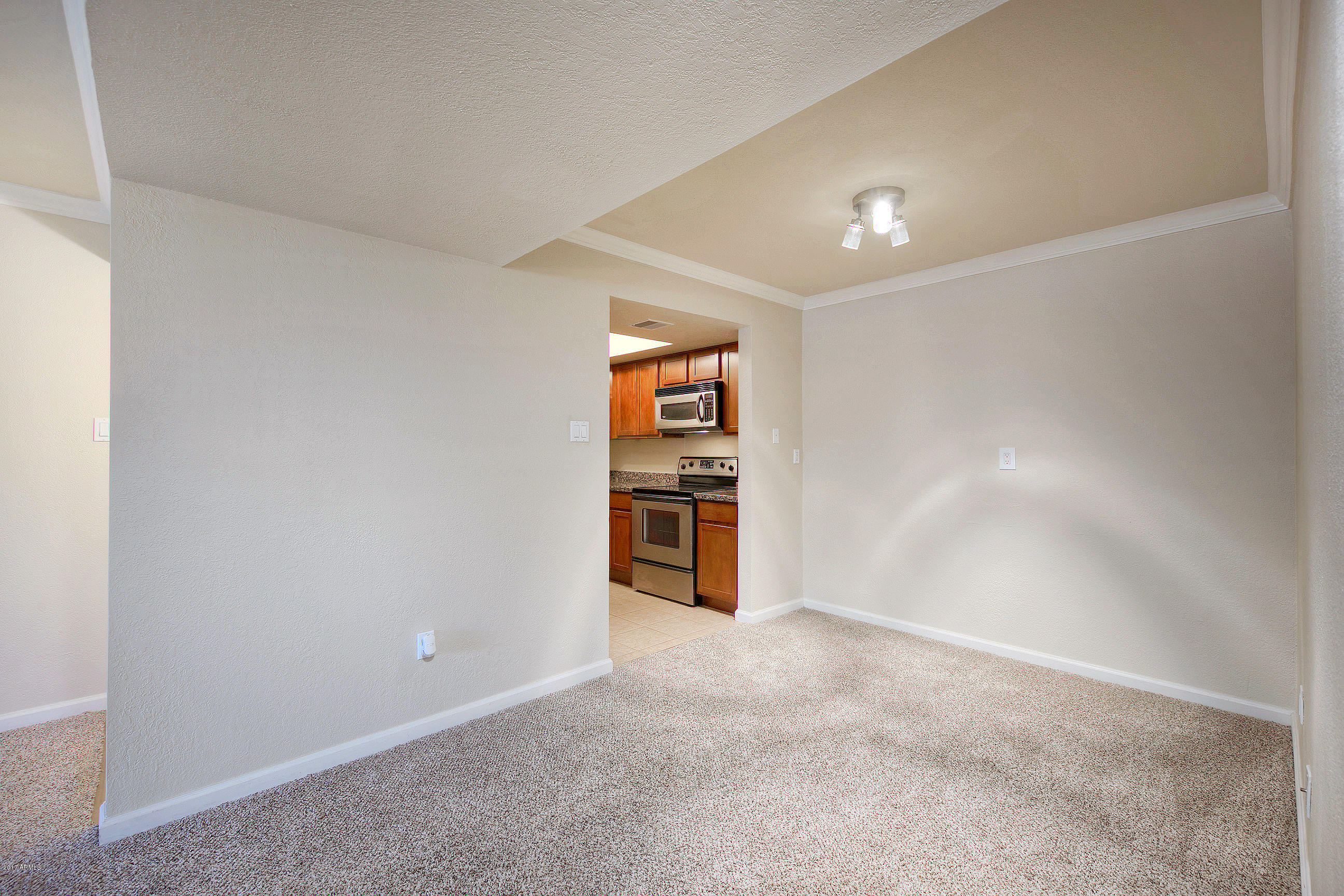 8256 East Arabian Trail, Unit 134 Scottsdale, AZ 85258 - Photo 7 of 24 a view of an empty room and window