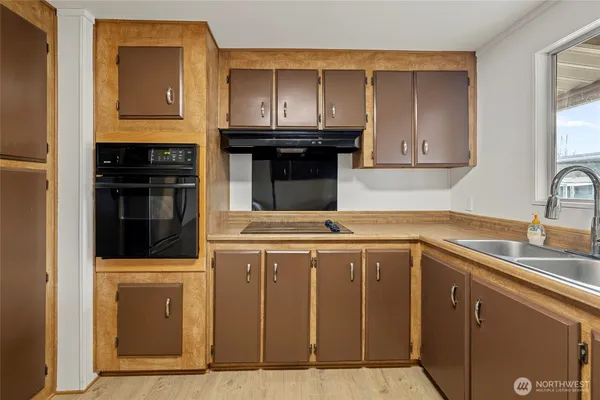 a kitchen with stainless steel appliances granite countertop a stove and a refrigerator