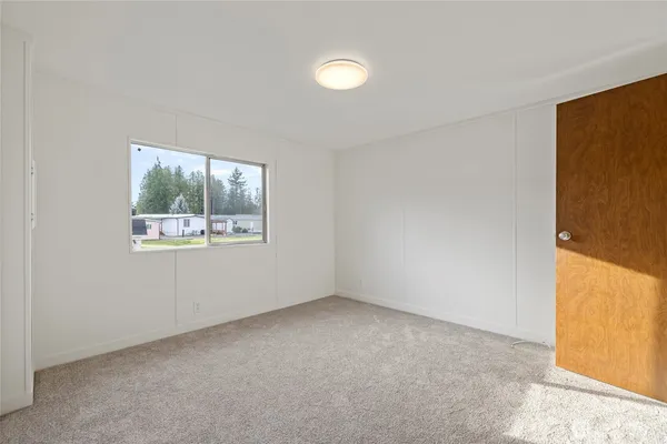 an empty room with windows and window